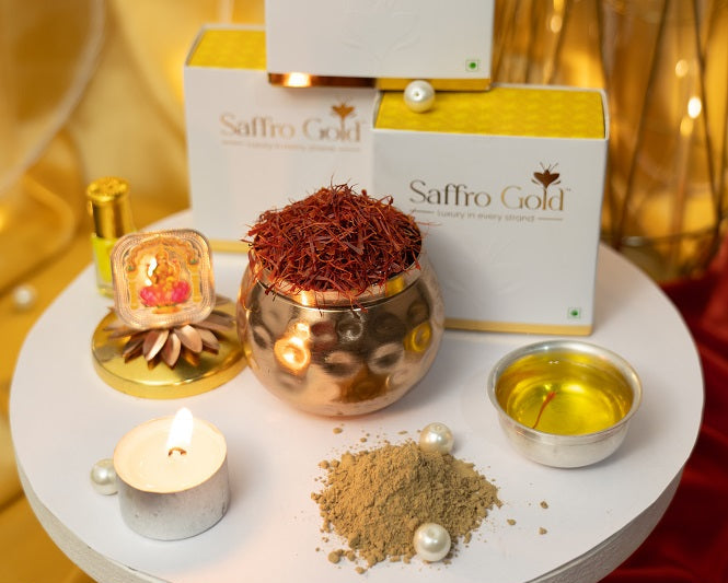 Luxury saffron display with Saffro Gold packaging, saffron threads, oil, and traditional decorative elements